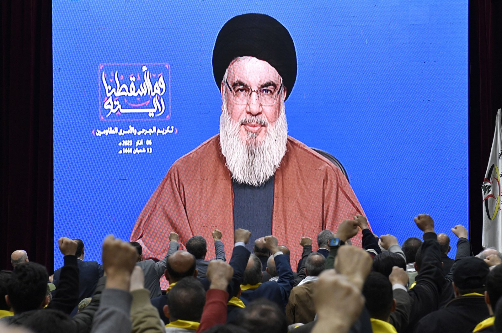 Supporters of Hezbollah listen to a speech by Hezbollah leader Sayyed Hassan Nasrallah delivered on a big screen during a rally to commemorate Hezbollah Wounded Resistance Day, Beirut, Lebanon, March 6, 2023. (EPA Photo)
