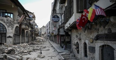 This picture shows collapsed buildings in the historic part of Hatay one month after a massive earthquake struck southeastern Türkiye, on March 6, 2023. (AFP Photo)