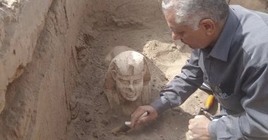 A sphinx statue believed to be made in the likeness of a Roman emperor is uncovered from an archaeological site in Qena, Egypt, March 6, 2023. (AP Photo)