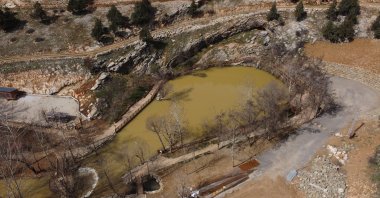 An aerial view of Yeşilgöz Lake, which turned brown after the strong 7.7 and 7.6 earthquakes, Kahramanmaraş, southeastern Türkiye, March 7, 2023. (AA Photo)