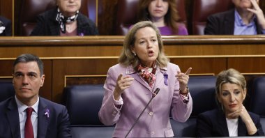 Spanish Deputy Prime Minister and Minister of Economy Nadia Calvino (C), bearing a pink ribbon on her lapel for Women&#039;s Day anniversary, delivers a speech during a Spanish Government&#039;s Question Time session at Lower Chamber of Spanish Parliament, in Madrid, Spain, March 8, 2023. (EPA Photo)
