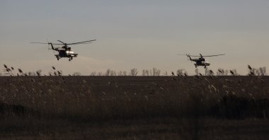 Ukrainian Armed Forces helicopters fly over a field outside the frontline town of Bakhmut, Ukraine, March 5, 2023. (Reuters Photo)