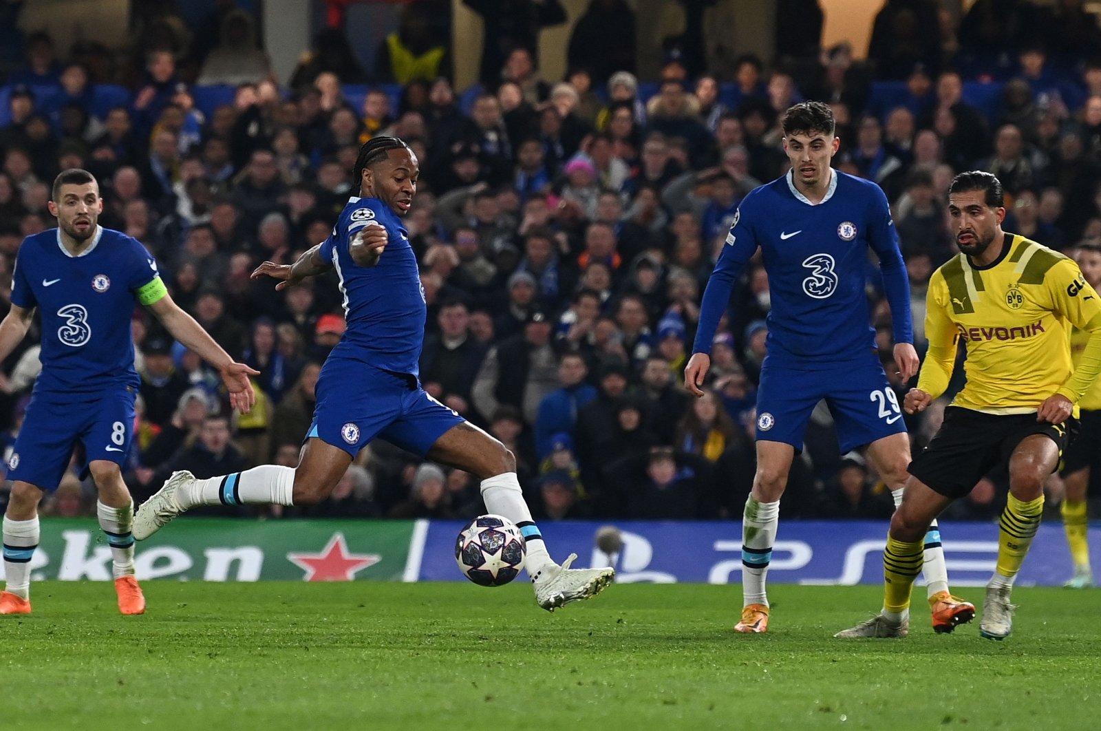 Chelsea&#039;s English midfielder Raheem Sterling scores the opening goal during the UEFA Champions League round of 16 second-leg football match against Borussia Dortmund at Stamford Bridge, London, UK., March 7, 2023. (AFP Photo)