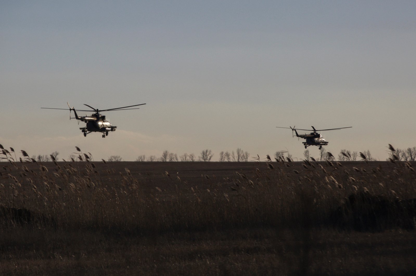 Ukrainian Armed Forces helicopters fly over a field outside the frontline town of Bakhmut, Ukraine, March 5, 2023. (Reuters Photo)