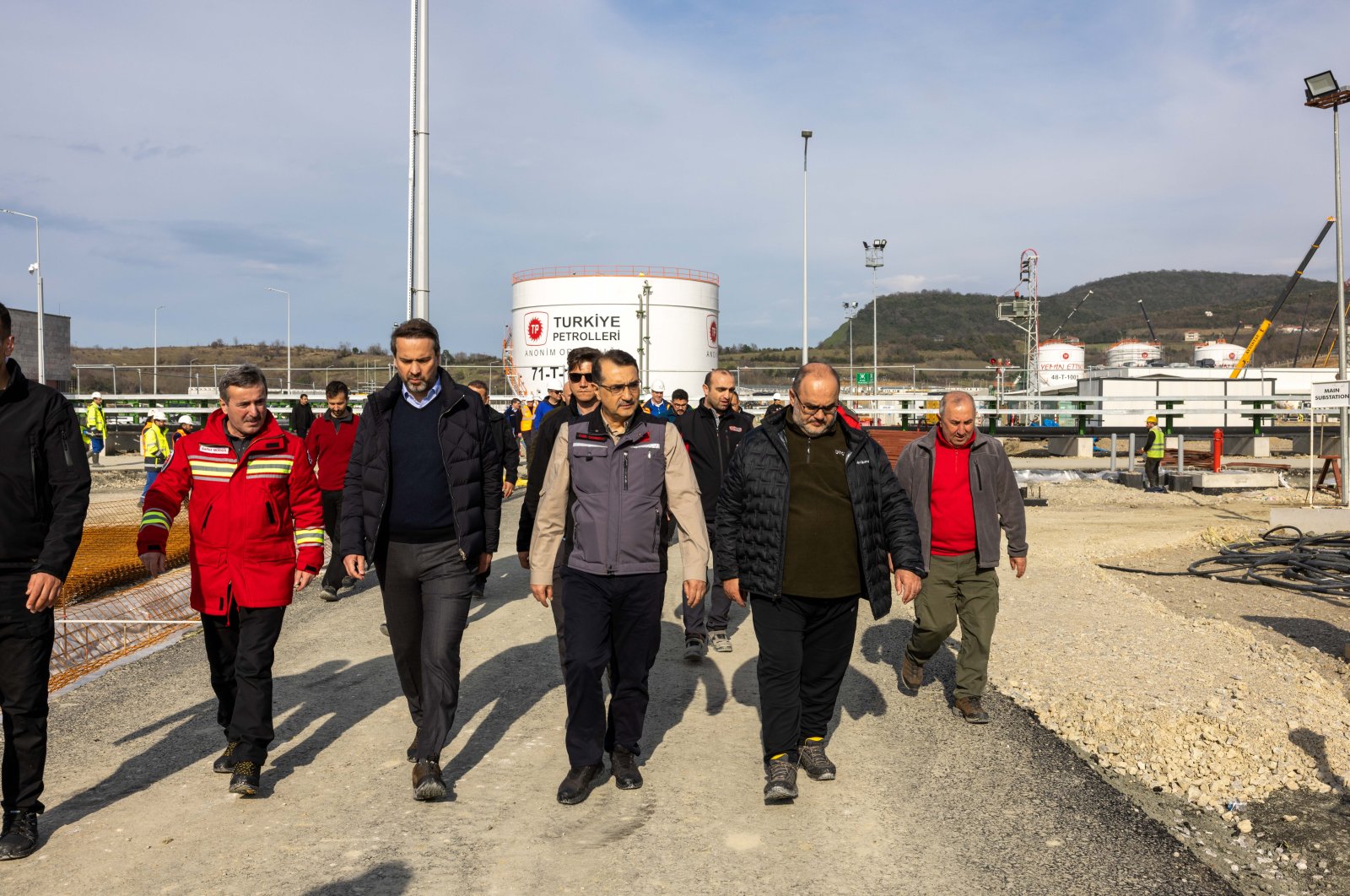 Energy and Natural Resources Minister Fatih Dönmez (C), accompanied by other officials, visits the gas processing facility at the Filyos Port in Zonguldak province, northern Türkiye, March 8, 2023. (AA Photo)