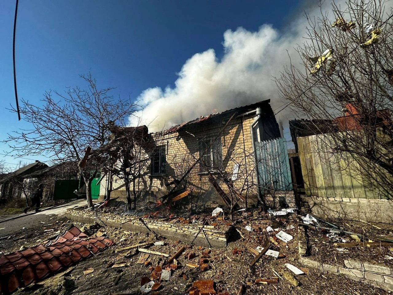 A burning residential house is seen after a Russian military strike, in Kherson, Ukraine, March 9, 2023. (Retuers Photo)