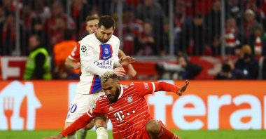 Bayern Munich's Eric Maxim Choupo-Moting in action with Paris St Germain's Lionel Messi during Champions League, round of 16, 2nd Leg match at the Allianz Arena, Munich, Germany, March 8, 2023. (Reuters Photo)  