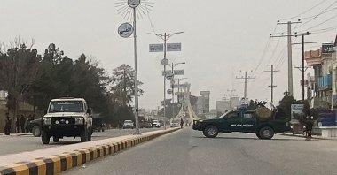 Taliban security personnel (R) block a road following a blast, Mazar-i-Sharif, Afghanistan, March 9, 2023. (AFP Photo)