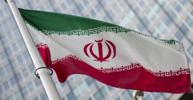 A flag of Iran flies in front of the International Atomic Energy Agency (IAEA) headquarters during a Board of Governors meeting at the IAEA headquarters of the UN seat in Vienna, Austria, March 6, 2023. (EPA Photo)