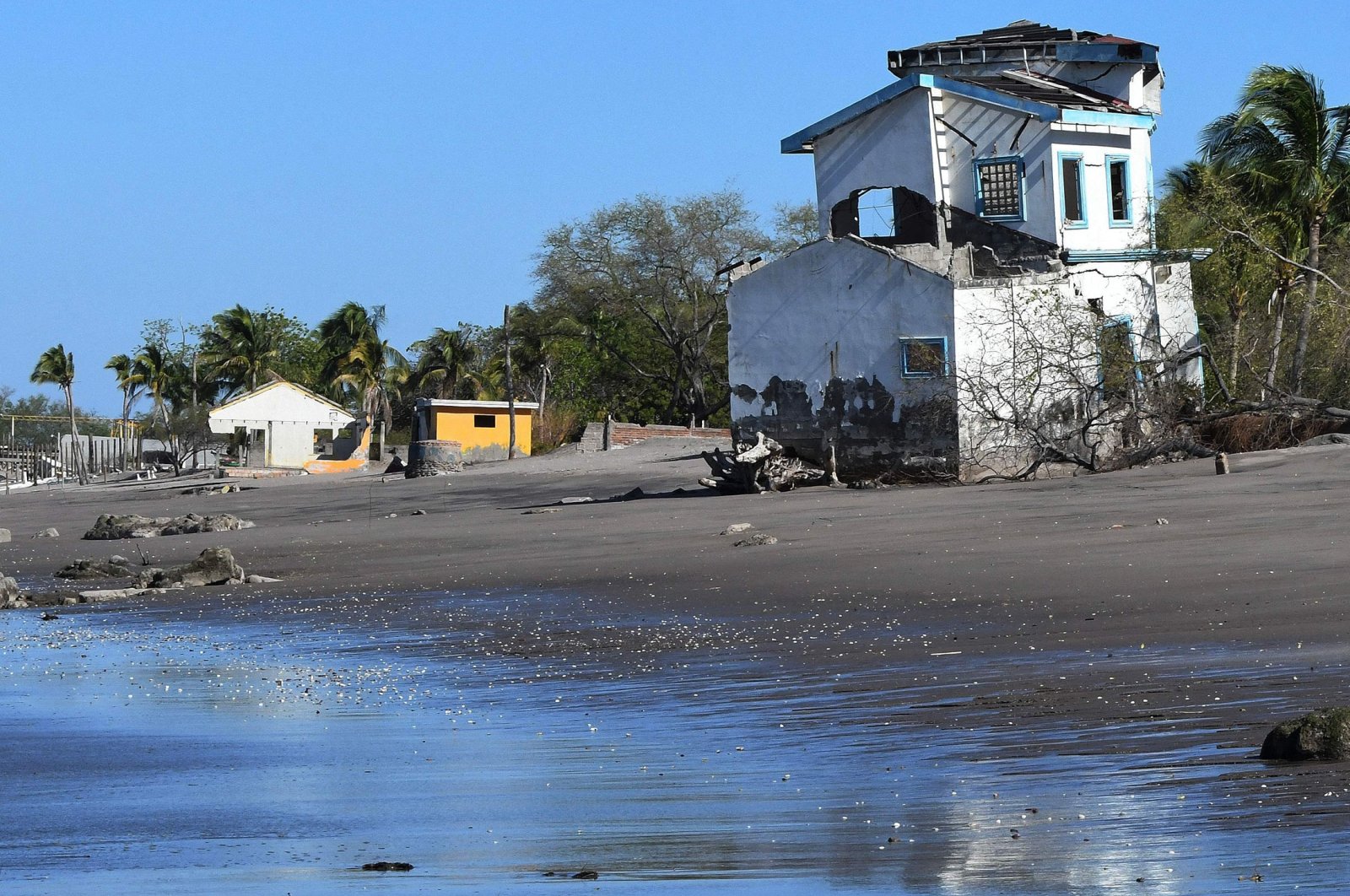Beach houses destroyed by the rising sea level in Cedeno, municipality of Marcovia, in the Gulf of Fonseca, Honduras, Feb. 20, 2023. (AFP Photo)