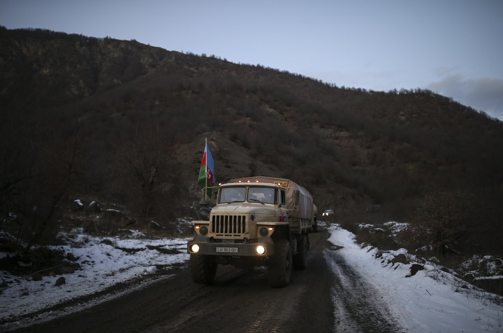 Azerbaijan&#039;s military trucks roll along a highway after the transfer of the Kalbajar region to Azerbaijan&#039;s control, as part of a peace deal that required Armenian forces to cede the Azerbaijani territories they held outside Nagorno-Karabakh, near Kalbajar, Azerbaijan, Wednesday, Dec. 2, 2020. (AP Photo)