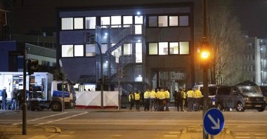 Police stand outside a Jehovah&amp;#039;s Witnesses center where several people have been killed in a shooting, Hamburg, Germany, March 9, 2023. (AFP Photo)