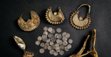 1000-year-old medieval treasure discovered in Hoogwoud, Netherlands, consisting of jewelery and silver coins, is shown in this undated handout picture. (Reuters Photo)
