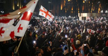 Georgian demonstrators join anti-government protests outside the parliament, Tbilisi, Georgia, March 9, 2023. (AFP Photo)
