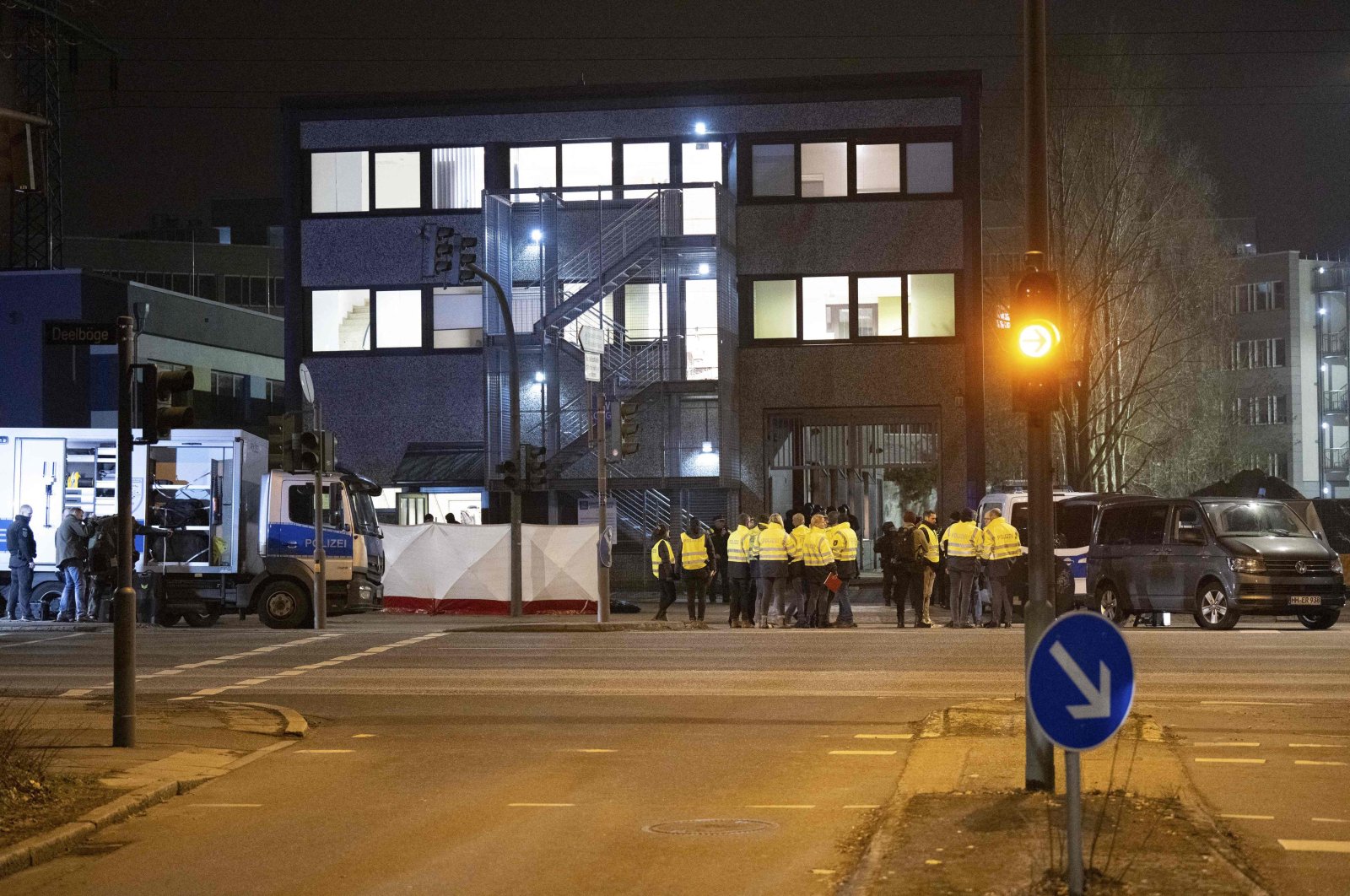 Police stand outside a Jehovah&amp;#039;s Witnesses center where several people have been killed in a shooting, Hamburg, Germany, March 9, 2023. (AFP Photo)