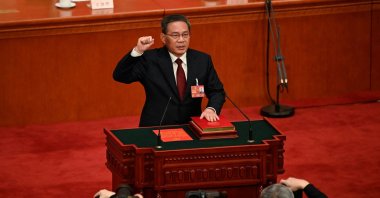 China's newly-elected Premier Li Qiang takes an oath after being elected, at the Great Hall of the People in Beijing, China, March 11, 2023. (AFP Photo)