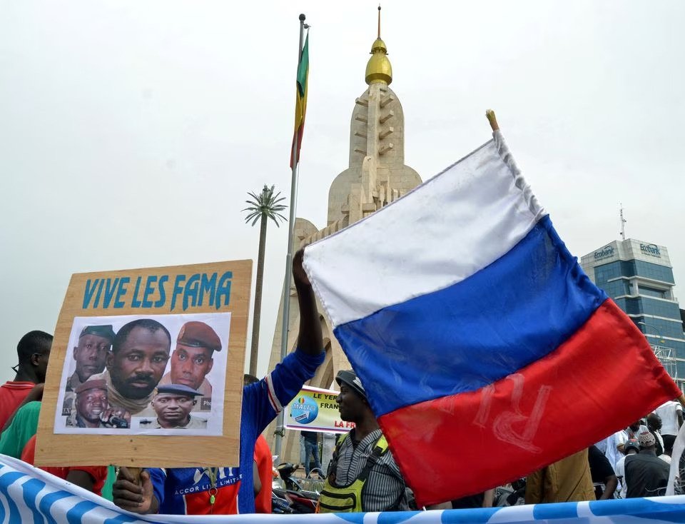 Malians hold a photograph with an image of Colonel Assimi Goita, leader of Mali&#039;s military junta, and Russia&#039;s flag during a pro-Malian Armed Forces (FAMA) demonstration in Bamako, Mali, May 28, 2021. (Reuters Photo)