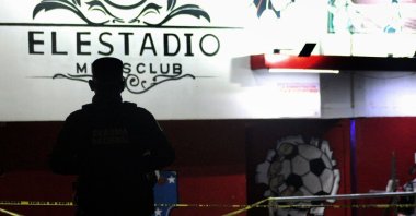 A member of the Mexican National Guard stands guard outside a night club where 10 people were killed and seven others injured, Guanajuato state, Mexico, March 12, 2023. (AFP Photo)