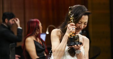 Best Actress Michelle Yeoh reacts after having her Oscar engraved at the Governors Ball following the Oscars show at the 95th Academy Awards in Hollywood, Los Angeles, California, U.S., March 12, 2023. (Reuters Photo)