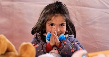 A child participates in an activity to entertain and support the mental health of those affected by the deadly earthquakes, at a camp for survivors, in Adıyaman, southeastern Türkiye, Feb. 18, 2023. (Reuters Photo)