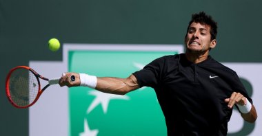 Chilean Cristian Garin plays a forehand in his match against Casper Ruud of Norway during the BNP Paribas at the Indian Wells Tennis Garden, Indian Wells, California, U.S., March 12, 2023. (AFP Photo)