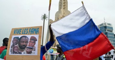 Malians hold a photograph with an image of Colonel Assimi Goita, leader of Mali&#039;s military junta, and Russia&#039;s flag during a pro-Malian Armed Forces (FAMA) demonstration in Bamako, Mali, May 28, 2021. (Reuters Photo)