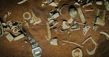 Items found by treasure hunters in the Danish national museum exhibition, in Copenhagen, Denmark, Feb. 4, 2023. (AFP Photo)