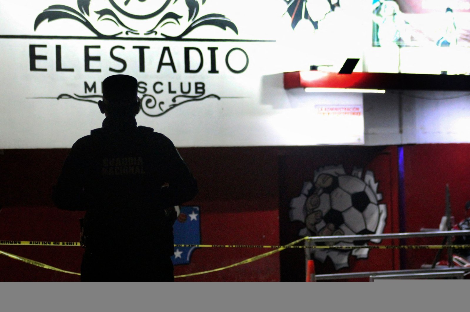 A member of the Mexican National Guard stands guard outside a night club where 10 people were killed and seven others injured, Guanajuato state, Mexico, March 12, 2023. (AFP Photo)