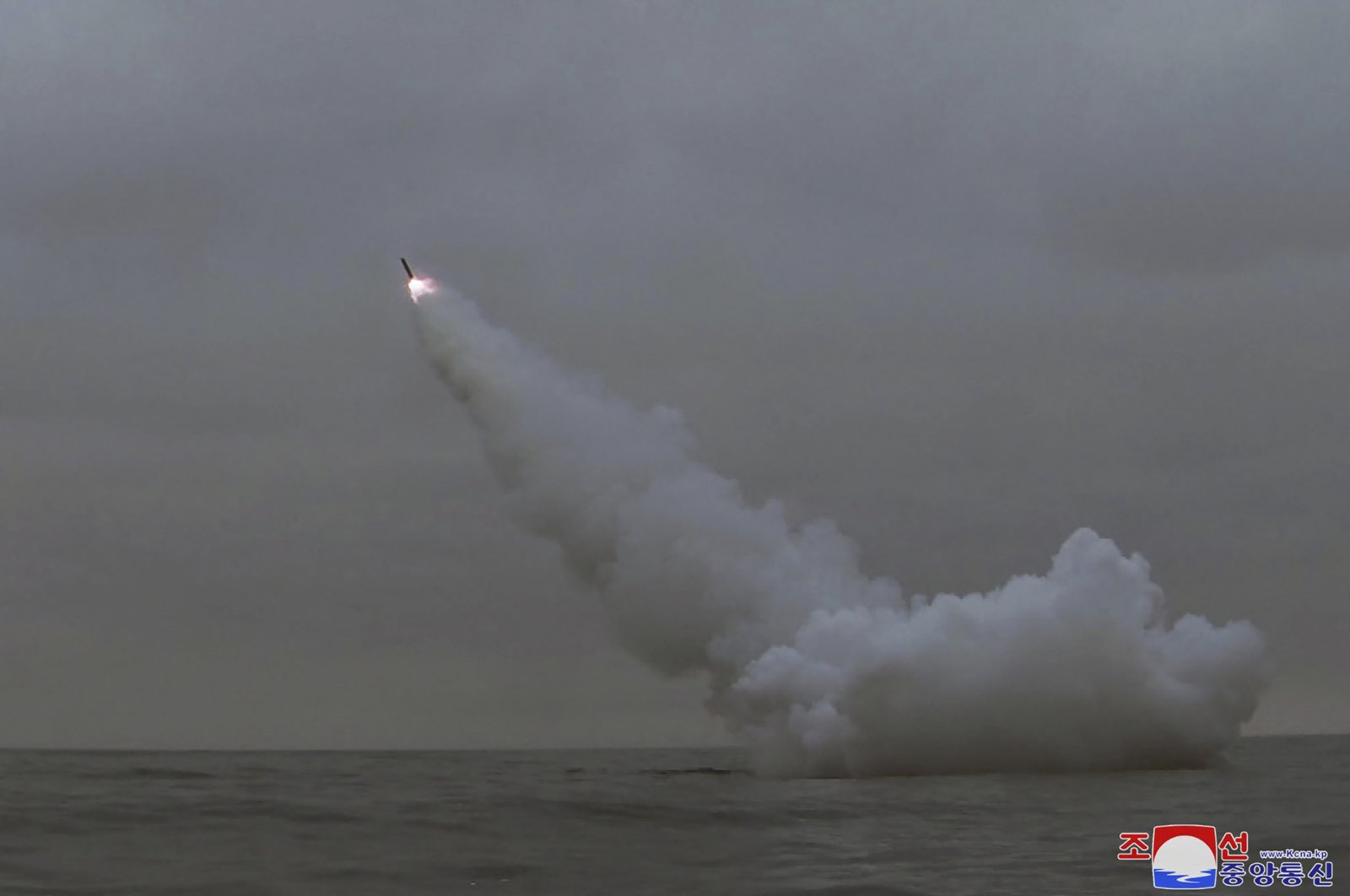 A strategic cruise missile being fired from a submarine in the waters of Gyeongpo Bay, North Korea, March 13, 2023. (AFP Photo)