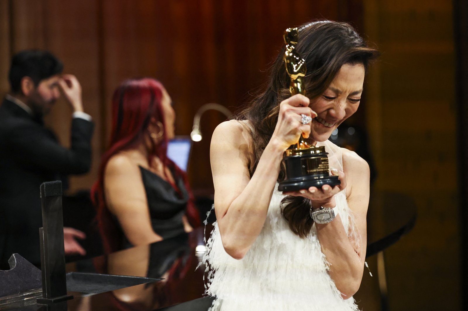 Best Actress Michelle Yeoh reacts after having her Oscar engraved at the Governors Ball following the Oscars show at the 95th Academy Awards in Hollywood, Los Angeles, California, U.S., March 12, 2023. (Reuters Photo)