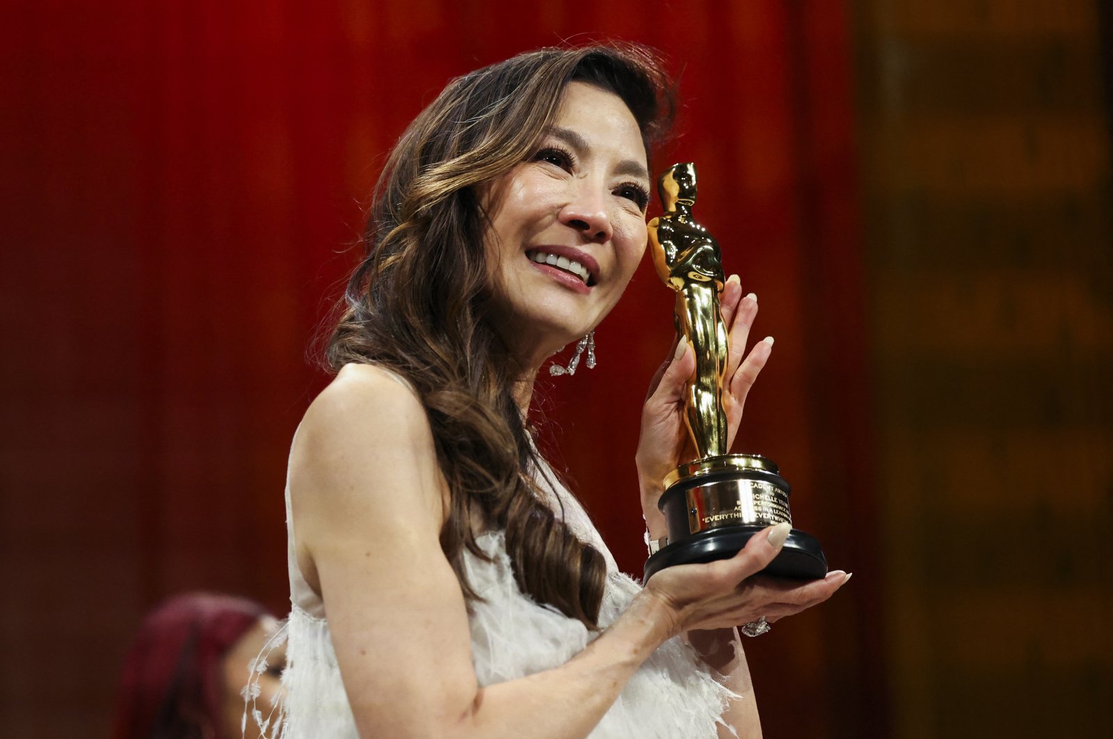 Best Actress Michelle Yeoh poses with her Oscar at the Governors Ball following the Oscars show at the 95th Academy Awards in Hollywood, Los Angeles, California, U.S., March 12, 2023. (Reuters Photo)