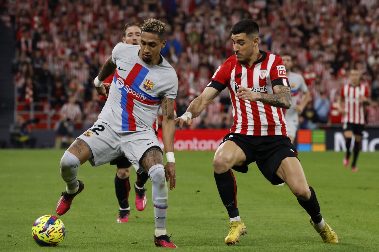 FC Barcelona&#039;s Raphinha in action with Athletic Bilbao&#039;s Yuri Berchiche during a LaLiga match at San Mames, Bilbao, Spain, March 12, 2023. (Reuters Photo) 