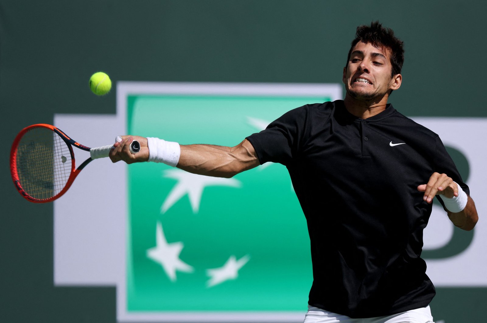 Chilean Cristian Garin plays a forehand in his match against Casper Ruud of Norway during the BNP Paribas at the Indian Wells Tennis Garden, Indian Wells, California, U.S., March 12, 2023. (AFP Photo)