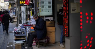 A screen displays exchange rates in a currency exchange shop on a commercial street in Istanbul, Türkiye, April 14, 2022. (AP Photo)
