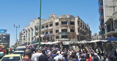A handout picture released by the local news site Suwayda 24 shows Syrians chanting anti-regime slogans as they protest the country&#039;s deteriorating economic conditions and corruption, in the southern city of Suwaida, June 9, 2020. (AFP Photo)