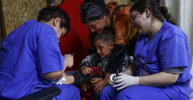 An earthquake victim receives treatment on the ship Orhan Gazi 1, which was converted into a hospital following a powerful earthquake in Iskenderun, Hatay, Türkiye, March 1, 2023. (EPA Photo)