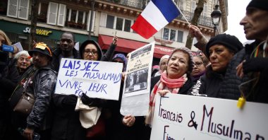 Protestors hold placards during a demonstration against islamophobia, Paris, France, Nov. 10, 2019. (AP Photo)