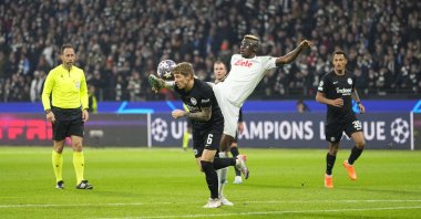 Napoli's Victor Osimhen and Eintracht Frankfurt's Kristijan Jakic battle for the ball during the UEFA Champions League round of 16 leg one match at Deutsche Bank Park, Frankfurt am Main, Germany, Feb. 21, 2023. (Getty Images Photo)