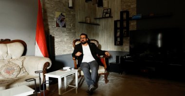 Iraqi journalist Muntadhar al-Zeidi sits at his home in Baghdad, Iraq, March 8, 2023. (Reuters Photo)