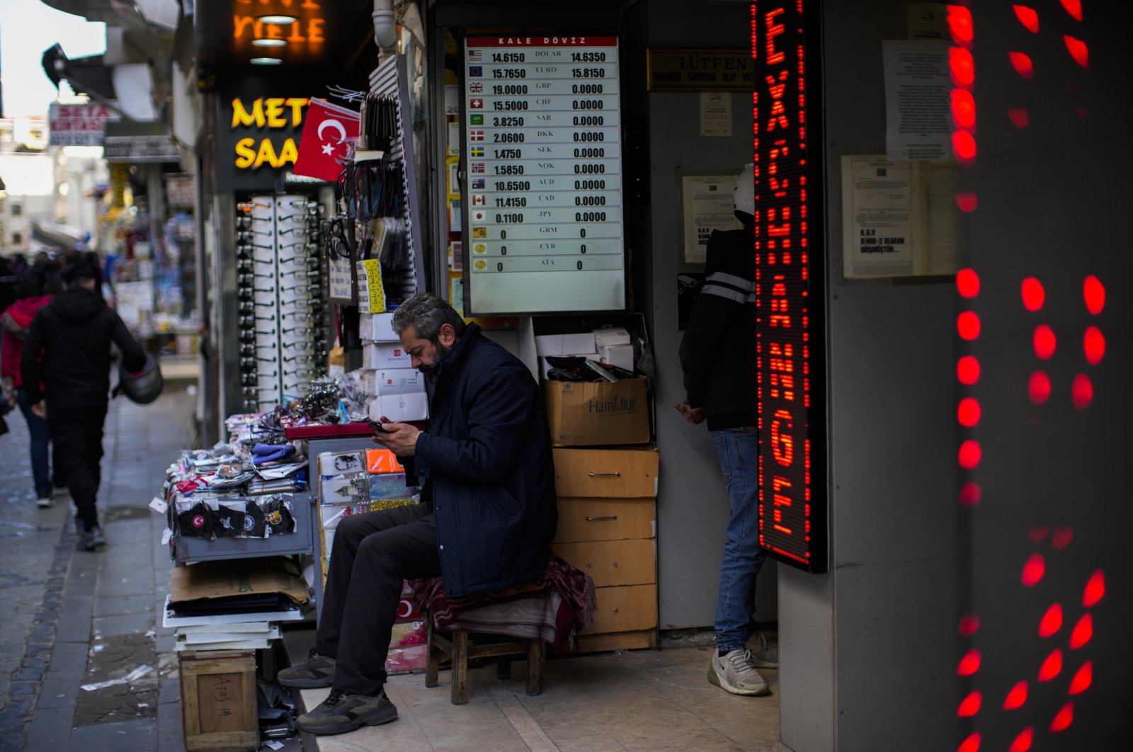 A screen displays exchange rates in a currency exchange shop on a commercial street in Istanbul, Türkiye, April 14, 2022. (AP Photo)