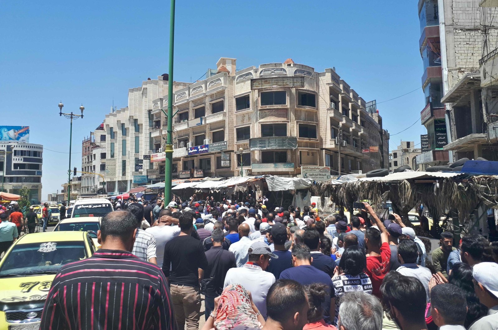 A handout picture released by the local news site Suwayda 24 shows Syrians chanting anti-regime slogans as they protest the country&#039;s deteriorating economic conditions and corruption, in the southern city of Suwaida, June 9, 2020. (AFP Photo)