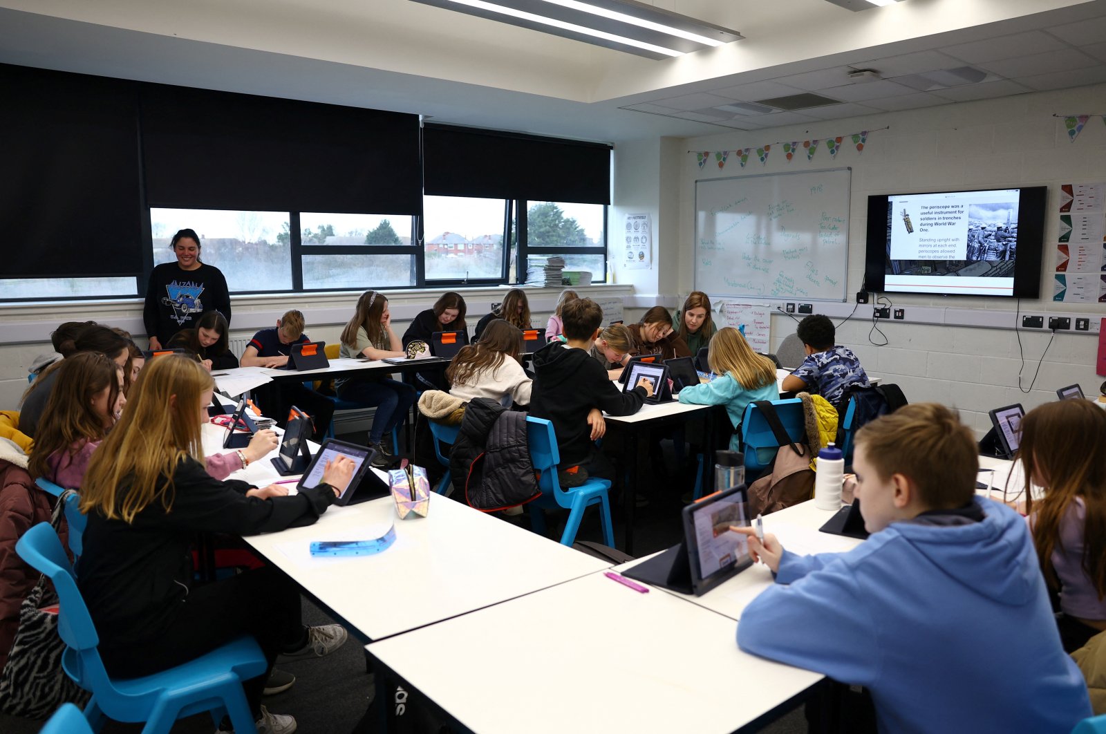 Pupils attend a lesson, at XP East High School, in Doncaster, Britain, Feb. 20, 2023. (Reuters Photo)
