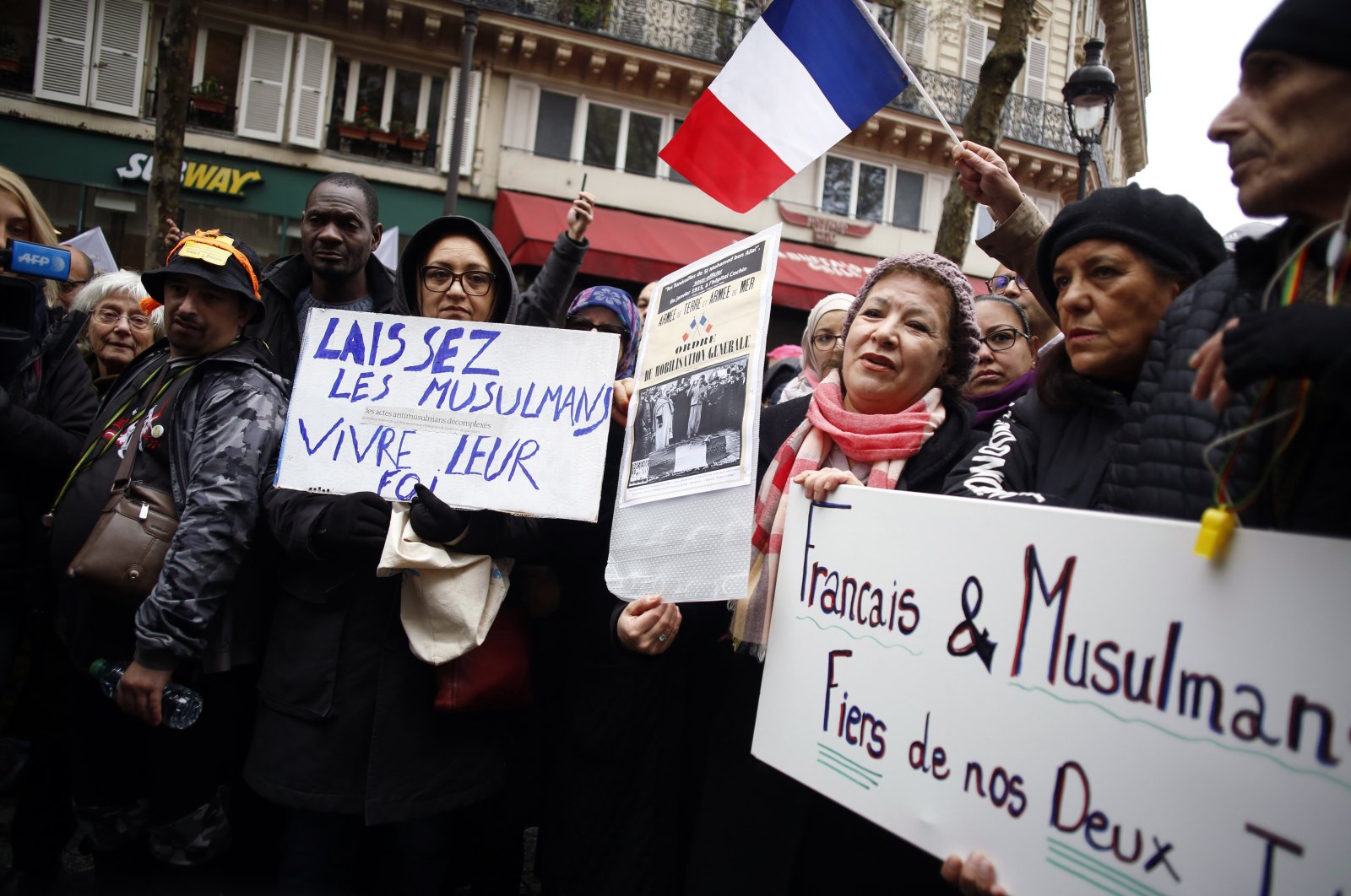 Protestors hold placards during a demonstration against islamophobia, Paris, France, Nov. 10, 2019. (AP Photo)