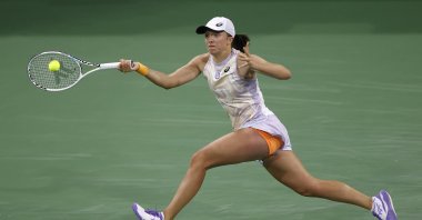 Polish Iga Swiatek in action against Great Britain's Emma Raducanu during the BNP Paribas Open tennis tournament at the Indian Wells Tennis Garden, Indian Wells, U.S., March 14, 2023. (EPA Photo)