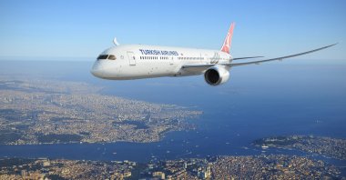 A THY plane seen over the skies of Istanbul in this photo dated Dec. 31, 2020. (Photo by THY via IHA)