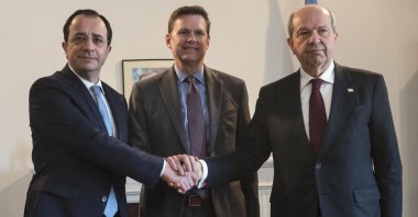 Newly elected Greek Cypriot administration head Nikos Christodoulides (L) meets Turkish Cypriot President Ersin Tatar (R) and Special Representative and Head of the U.N. Peacekeeping Force in Cyprus Colin William Stewart (C), Lefkoşa (Nicosia), Greek Cypriot administration, Feb. 23, 2023. (AFP Photo)