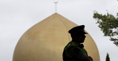 A police officer stands in a park near the Al Noor mosque in Christchurch, New Zealand, March 15, 2020. (AP Photo)