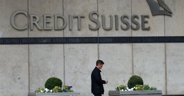 A man walks past the Credit Suisse office in Canary Wharf in London, Britain, March 16, 2023. (Reuters Photo)