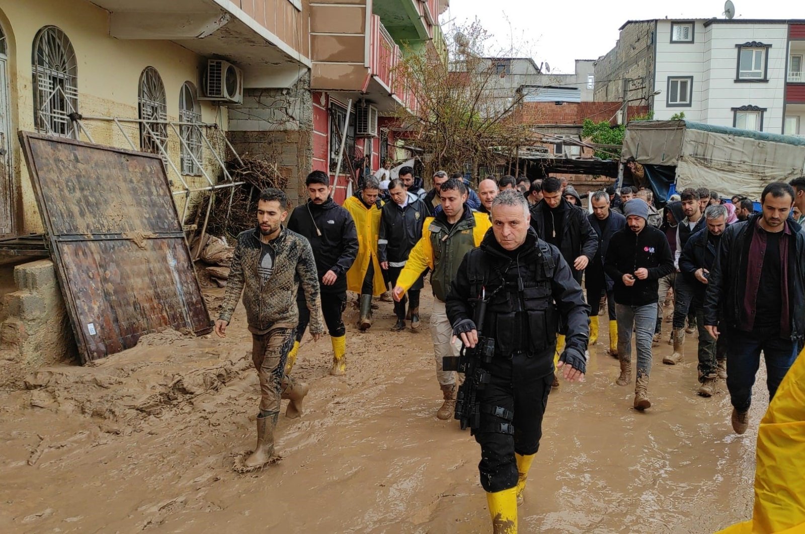 Group of people and search teams are seen in streets of Şanlıurfa amid flood, southeastern Türkiye, March 15, 2023. (IHA Photo)