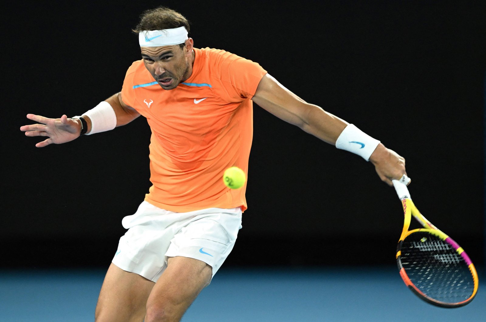 In this file photograph, Spain&#039;s Rafael Nadal hits a return to Mackenzie McDonald of the US during their men&#039;s singles match on day three of the Australian Open tennis tournament, Melbourne, Australia, Jan. 18, 2023